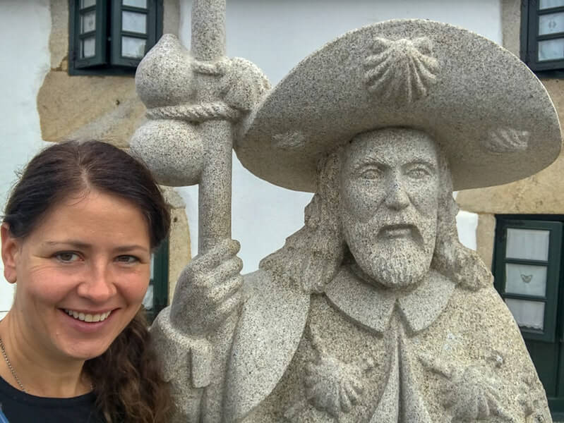 Pilgrim and statue of St James, who the Camino is named after 'The Way of St. James.'