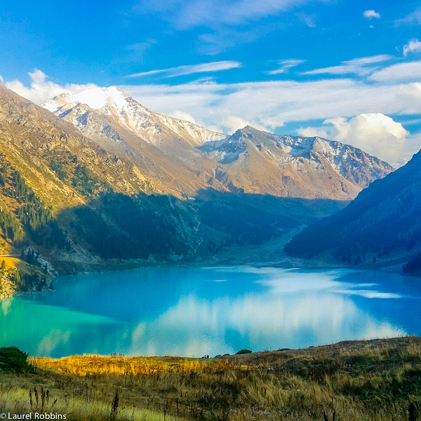 You'll find 3 peaks at ~ 4000 m high in the Tian Shan Mountains surrounding Big Almaty Lake