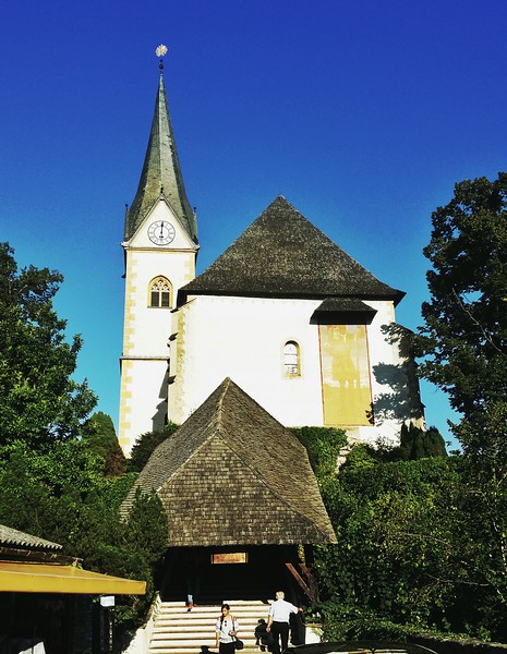 Pilrims and tourists visit the Pilgrim church in the village of Maria Wörth, on a peninsula on the Wörthersee. 