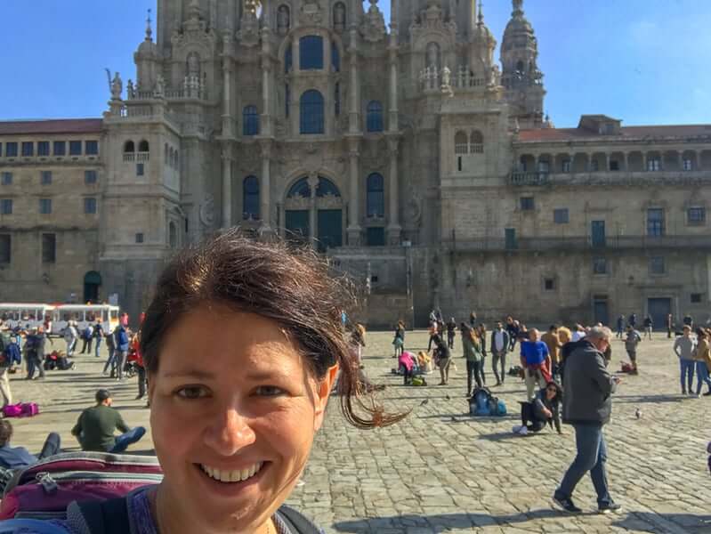 Many pilgrims take time to reflect on their Camino by the Santiago de Compostela Cathedral