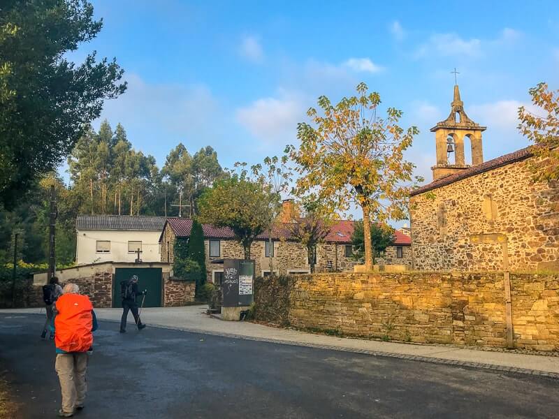 Pilgrim and a church on the Camino de Santiago