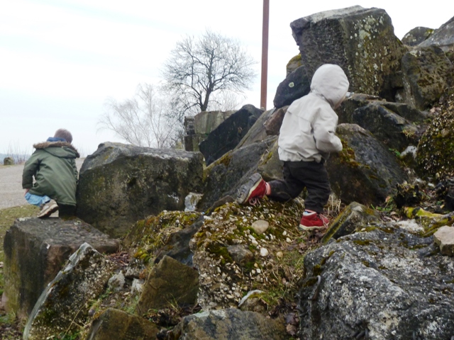 Children playing in rubble at the Birkenkopf Stuttgart, Germany