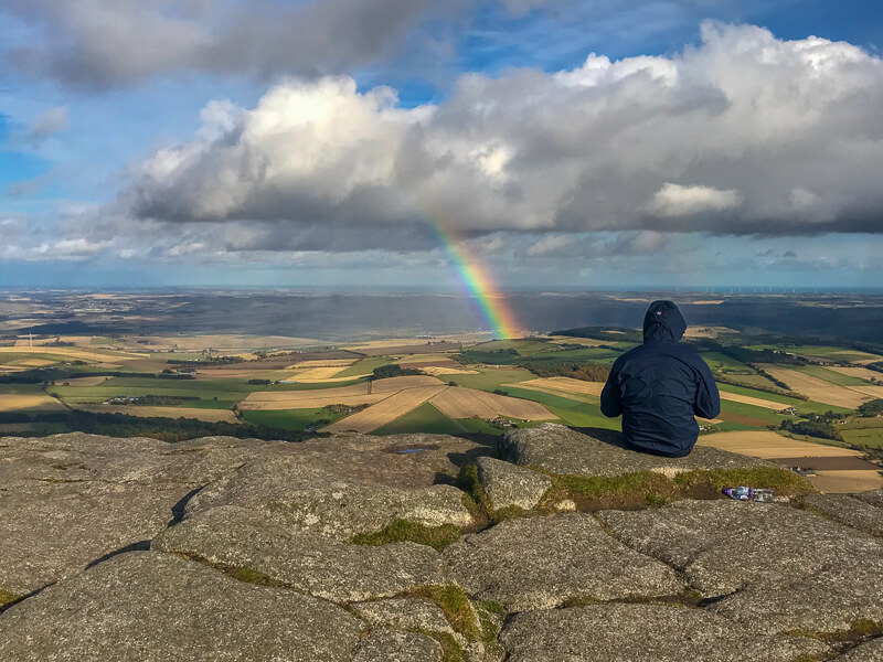 rainbow seen frop summit of Oxen Craig while hiking Bennachie in the Grampian mountain range in Aberdeenshire