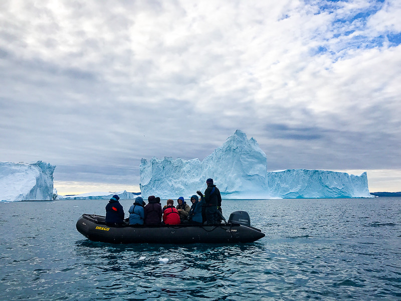 Adventurers enjoying the icebergs of Ilulissat via a zodiac ride.