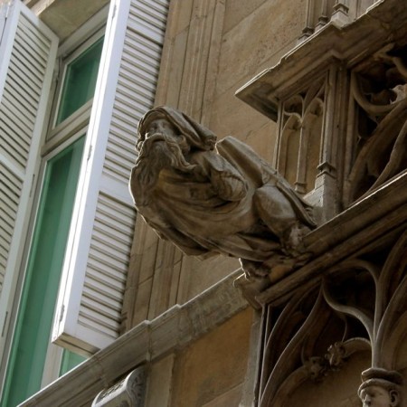 Petrified wizard on Bisbe Street in Barcelona's Gothic Quarter.