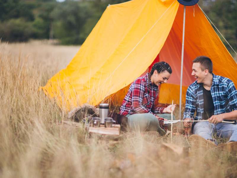 hikers using a multitool for backpacking while camping