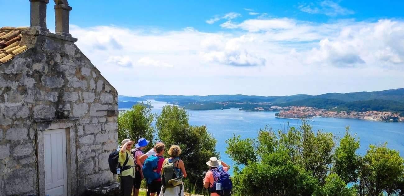 hiking tour of Croatia, hikers visiting a church with amazing views of the Adriatic Sea