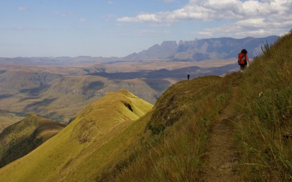 Hiker on the trail to Orange Peel Gap in the Drakensberg Mountains South Africa