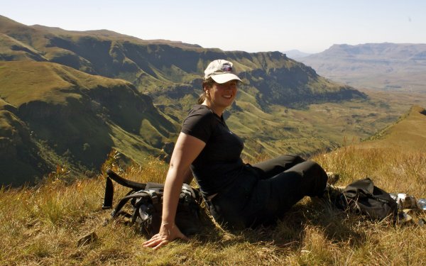 Adventure travel blogger, Laurel Robbins enjoying the views of the Drakensberg Mountains in South Africa