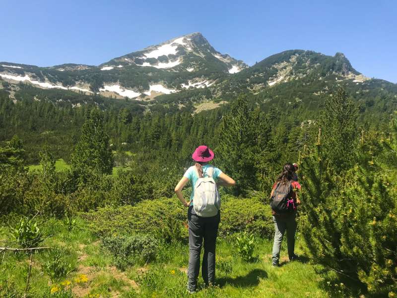 two friends, hiking together in the mountains