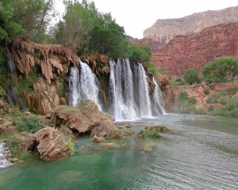 Visiting a waterfall at the Grand Canyon is a must on your trip.