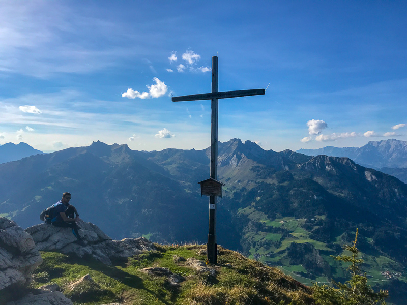 Hiker at the mountain peak of the Saukarkopf in Grossarl, Austria