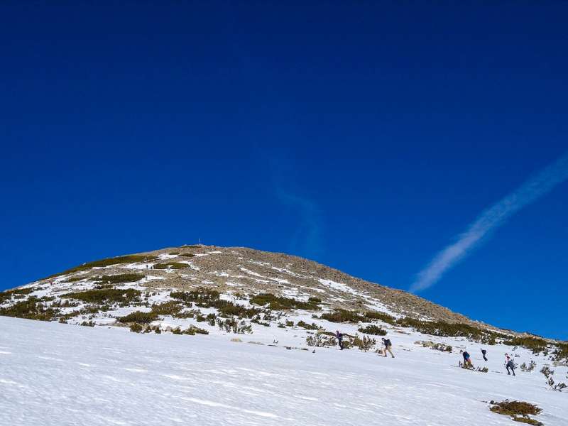 a group of hikers in a mountain in winter