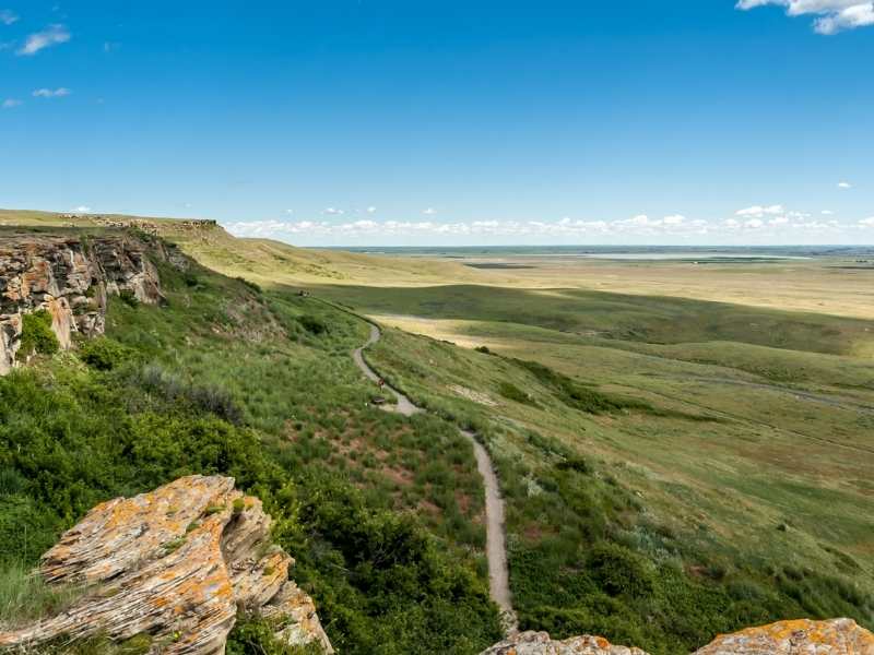 You can walk along a trail to get a good view of the buffalo jump.