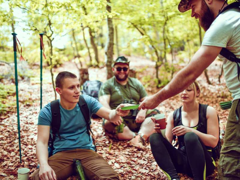 hikers eating breakfast together