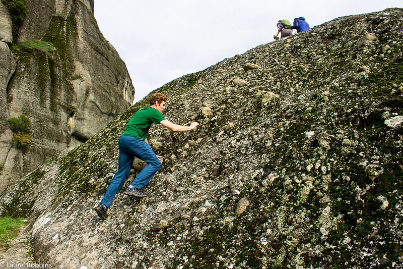 Scrambling the last section of rock on Holy Spirit Mountain in Meteora, Greece