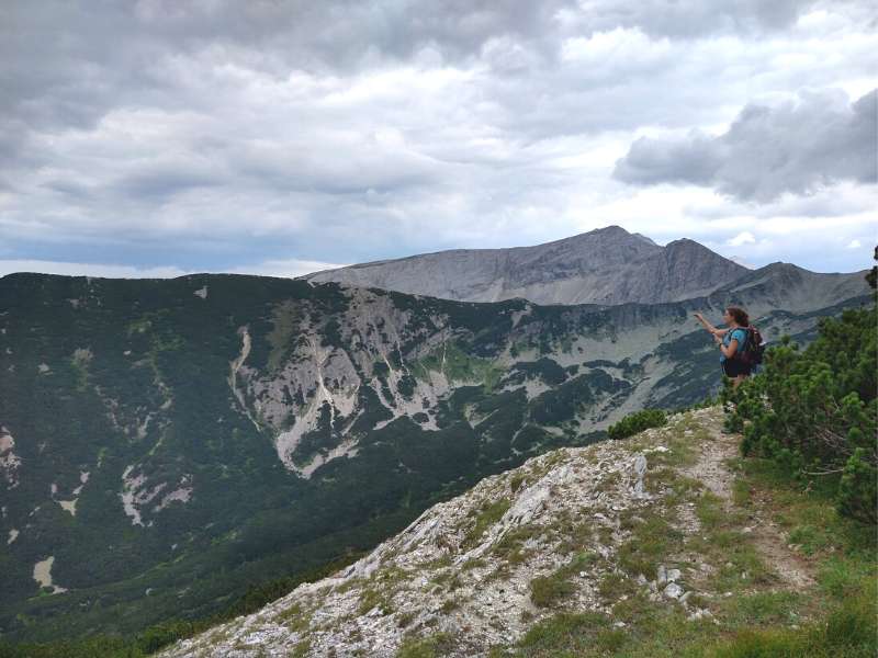 hiker enjoying the mountain views after hiking