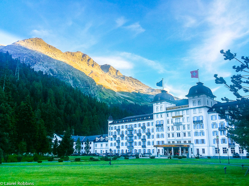 Kempinski Grand Hotel des Bains in St. Moritz with the Engadin mountains in the background.