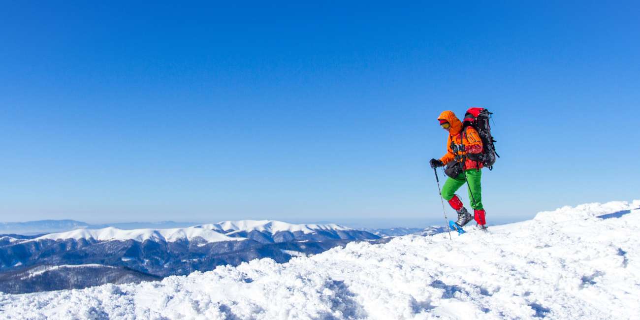 man hiking in a very cold weather