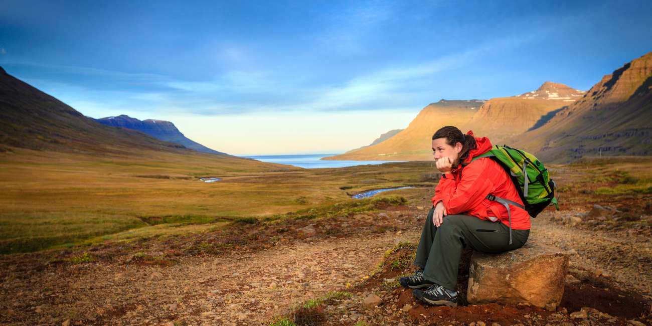 tired woman resting after hiking