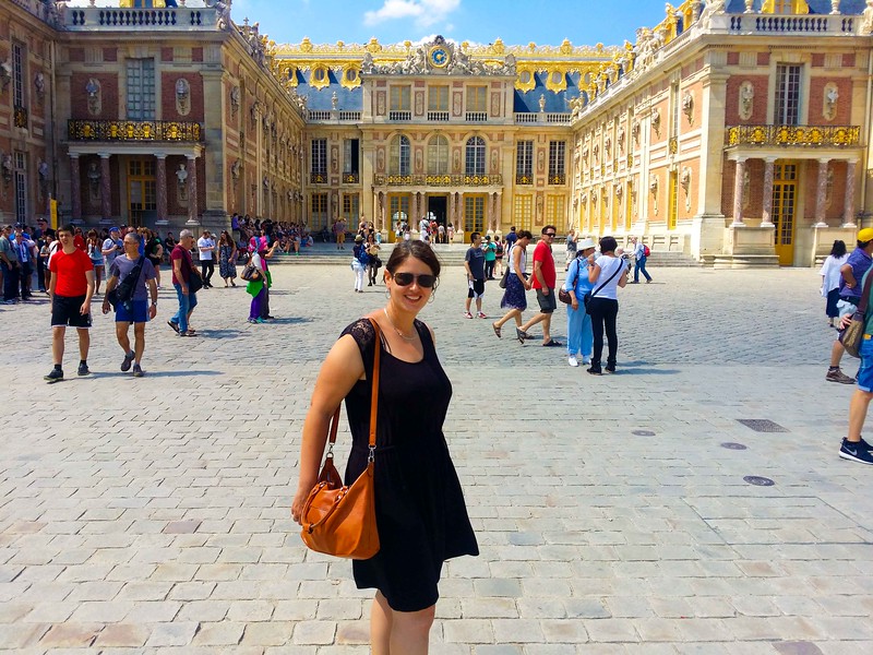 travel blogger visiting the Palace of Versailles