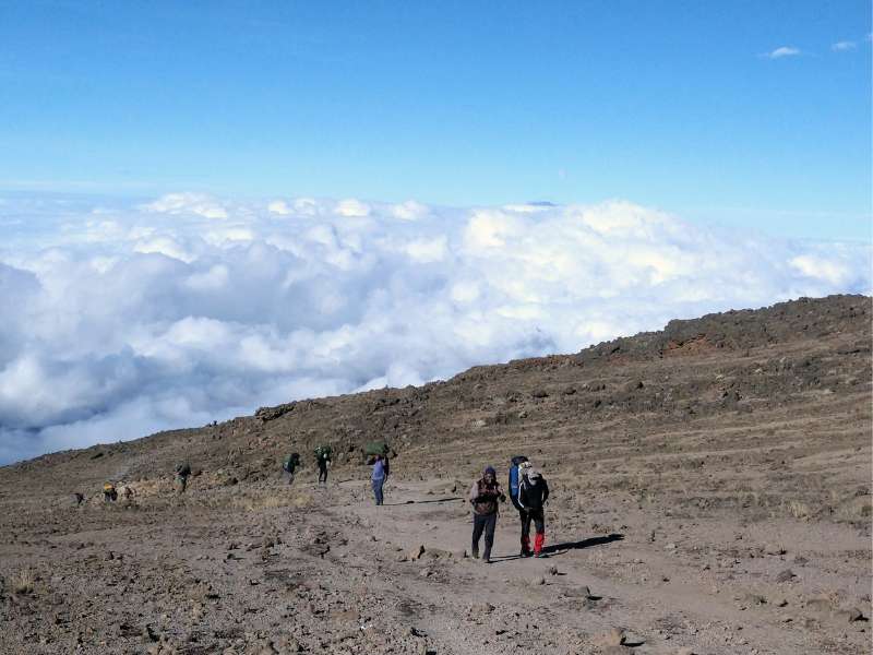 hikers ascending the mountain for Kilimanjaro tour day 6