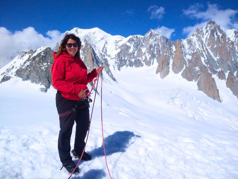 Laurel Robbins at the summit of Petit Flambeau with Mont Blanc in the background