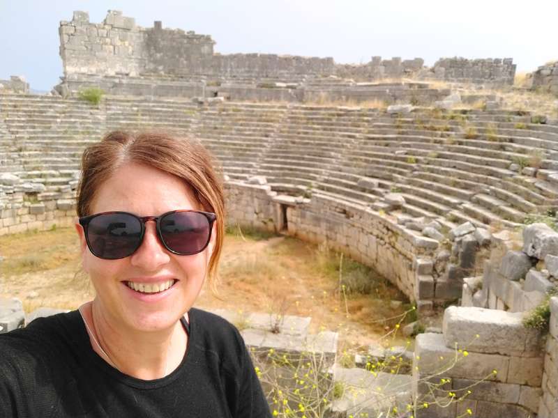 Laurel with an ancient ruins in the background during the west lycian way hiking tour