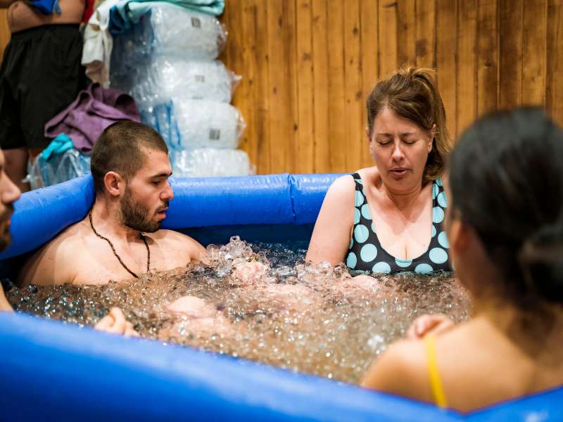 Laurel in an ice bath  at a Wim Hof Workshop