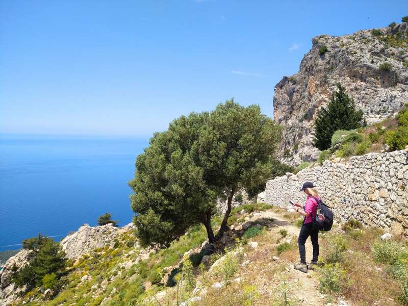 hiker enjoying the view of the sea at the top of the mountain during the lycian way tour