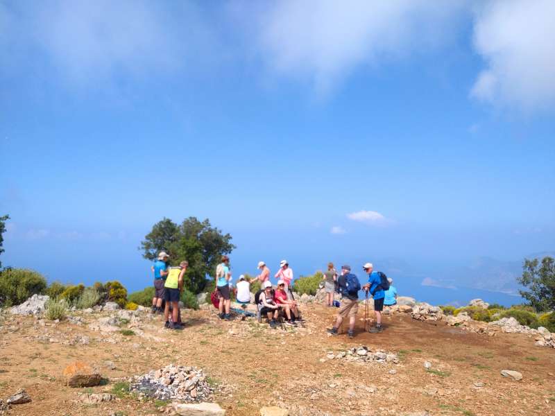 hikers enjoying the view of the sea from the top of the mountain during the lycian way hiking tour