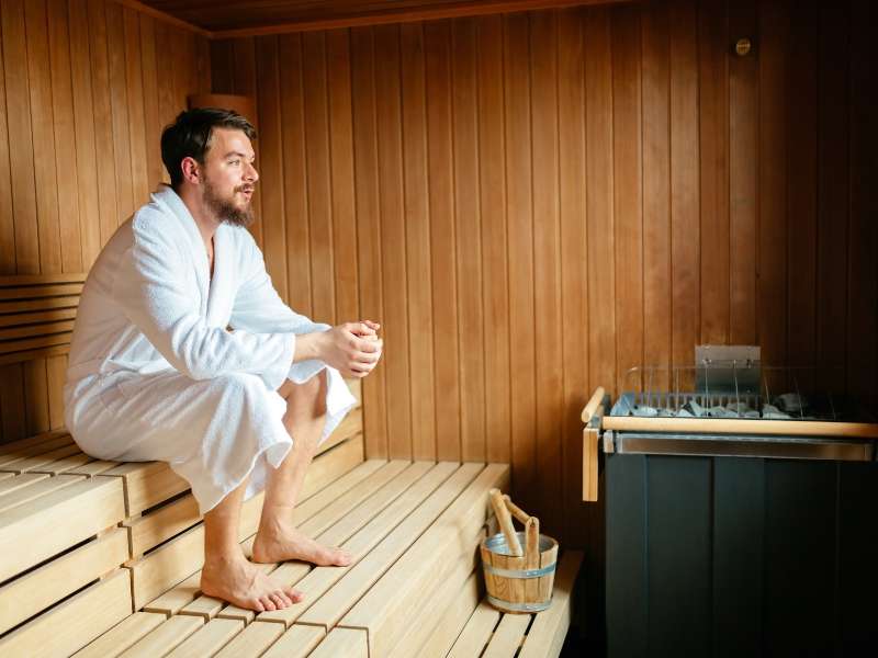 man relaxing in a sauna