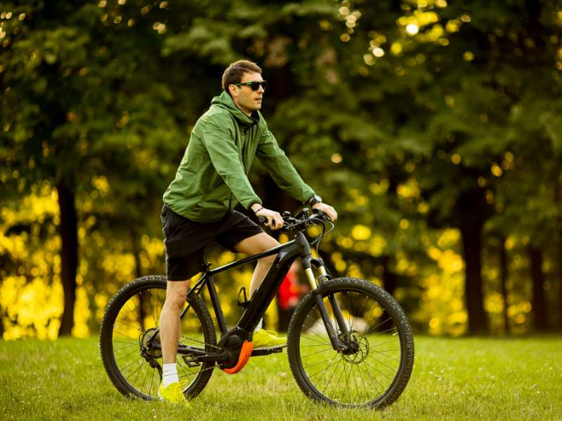 man riding on the park with an ebike