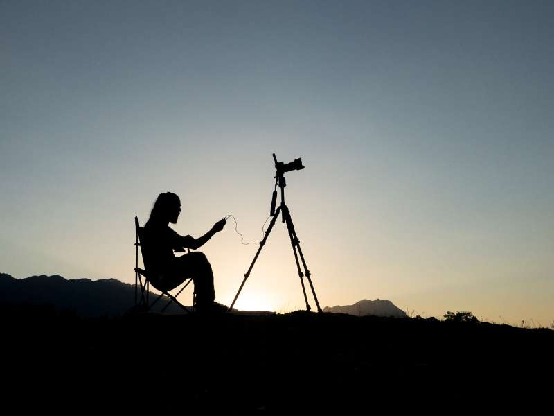 man capturing the mountain views