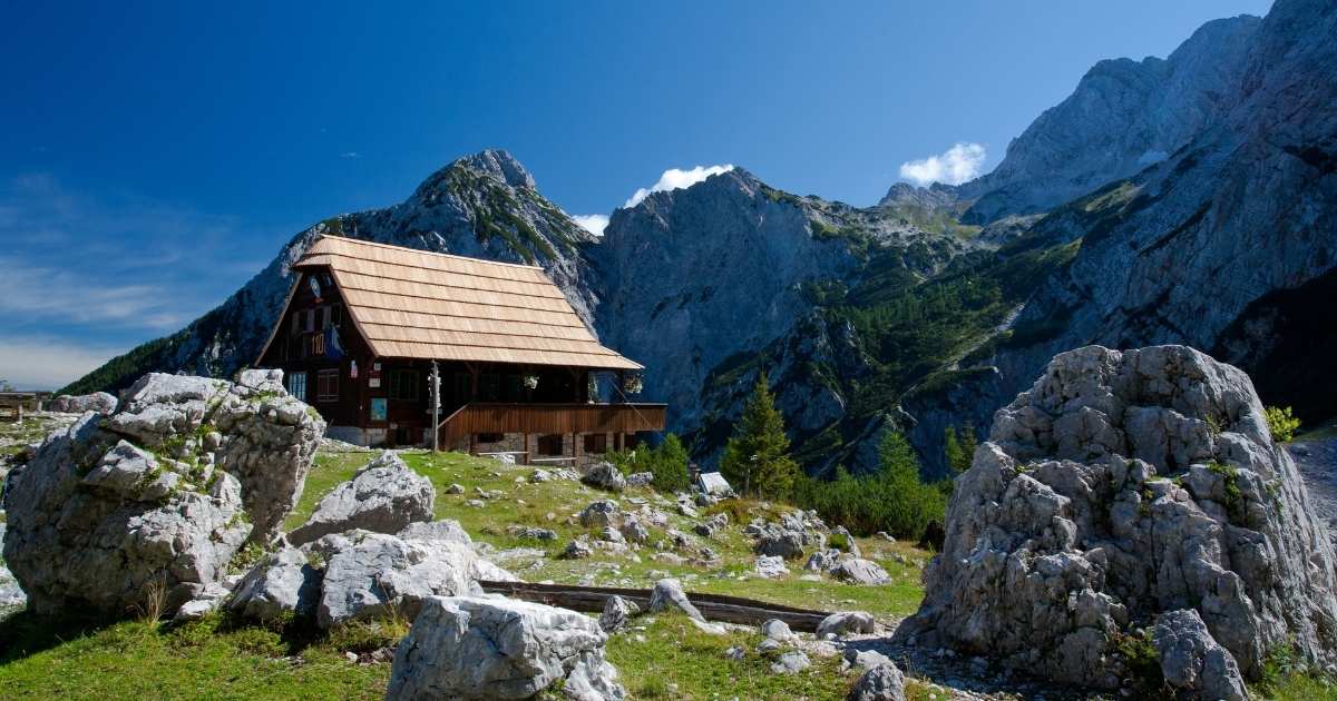 mountain hut with gorgeous mountain range in the background