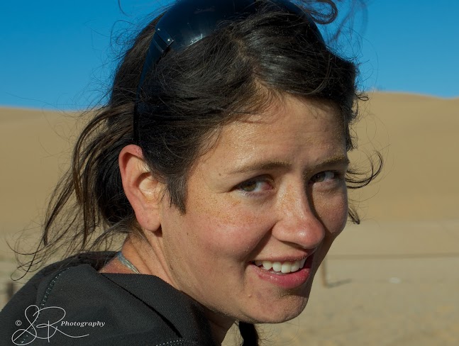 Laurel Robbins covered in sand after sandboarding