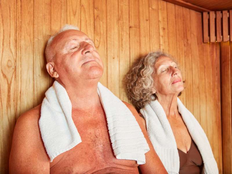 senior couple enjoying the sauna