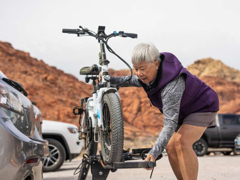 elderly woman checking her ebike