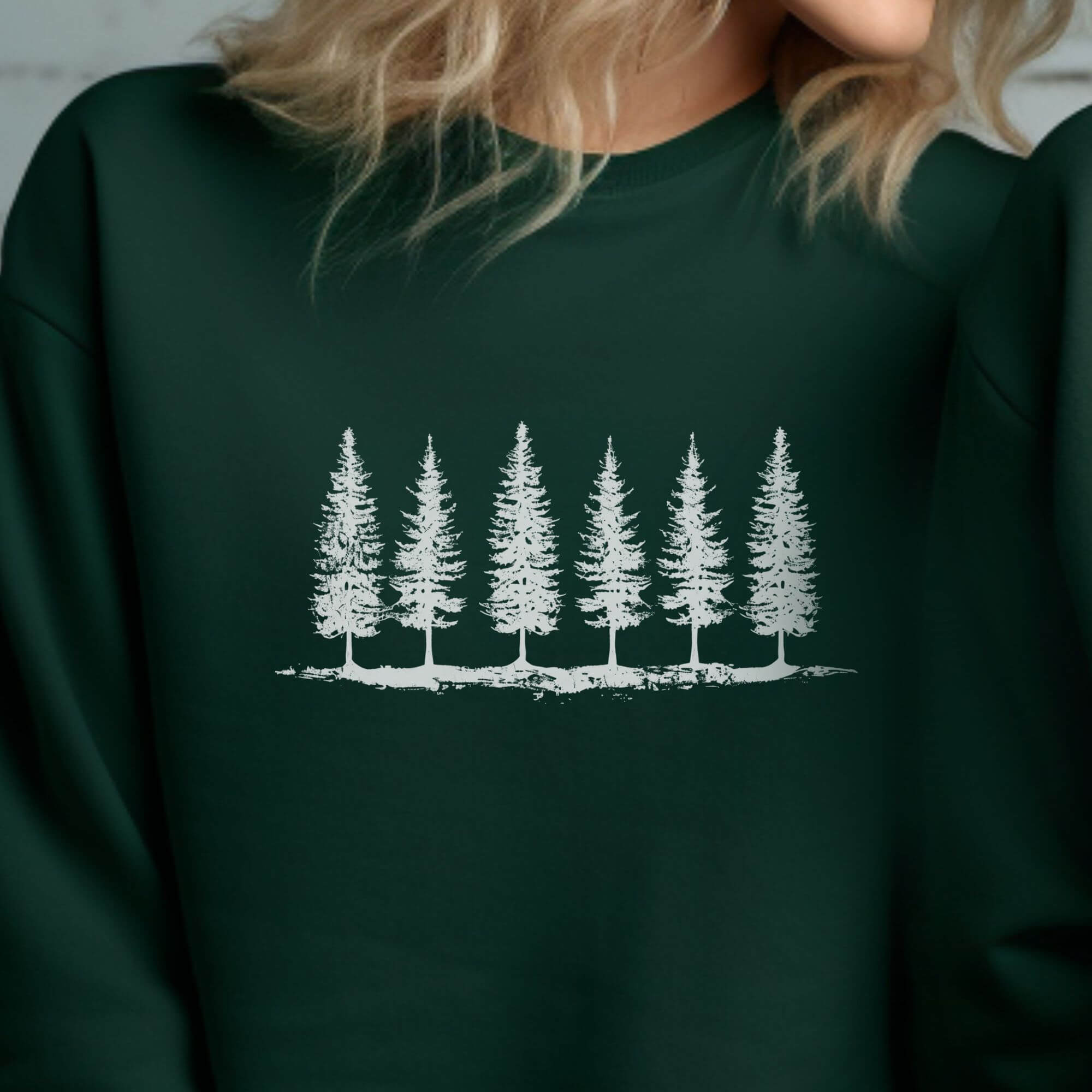 woman wearing pine tree sweatshirt