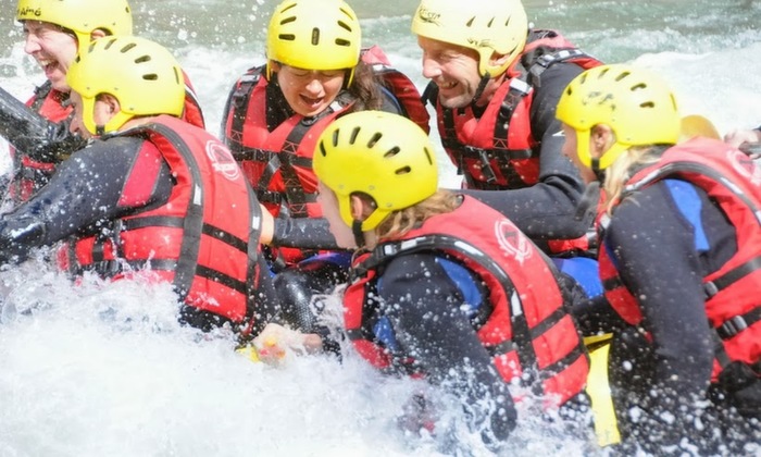 Eyes shut to try and keep the water out while rafting.