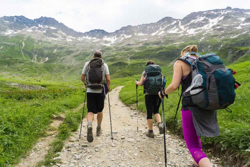 hikers on a flat section of the Tour du Mont Blanc