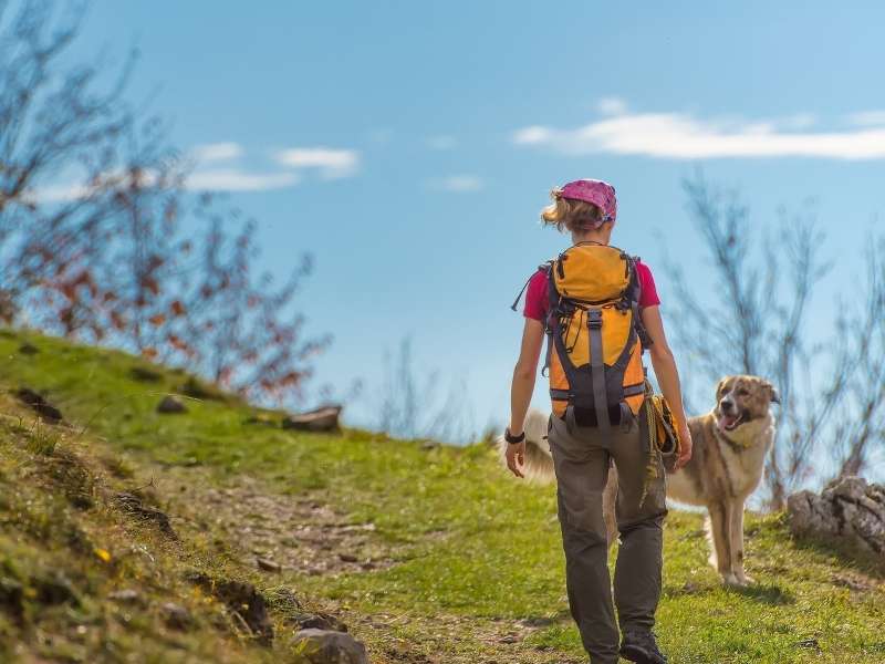 woman and dog hiking