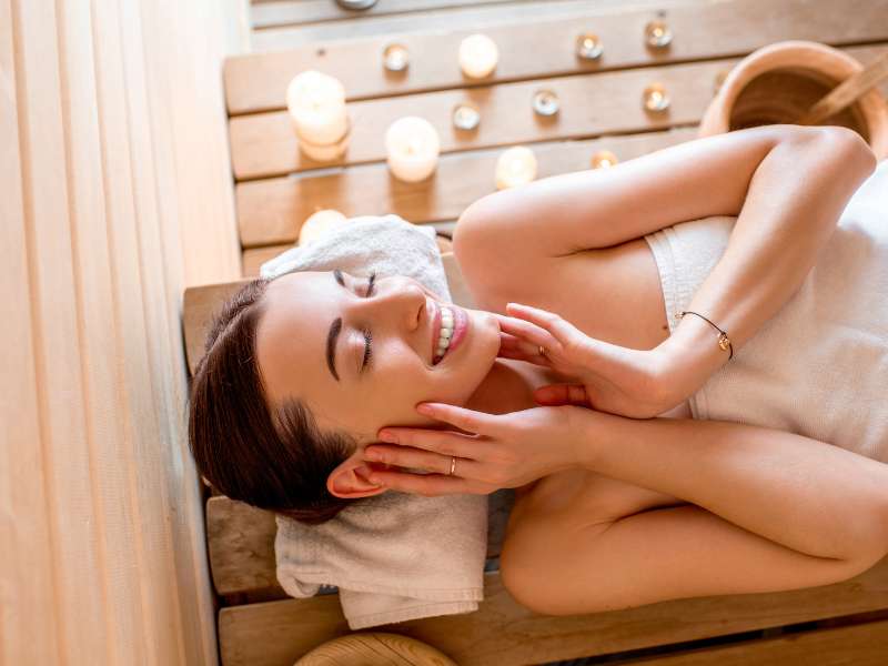 woman lying down in a sauna