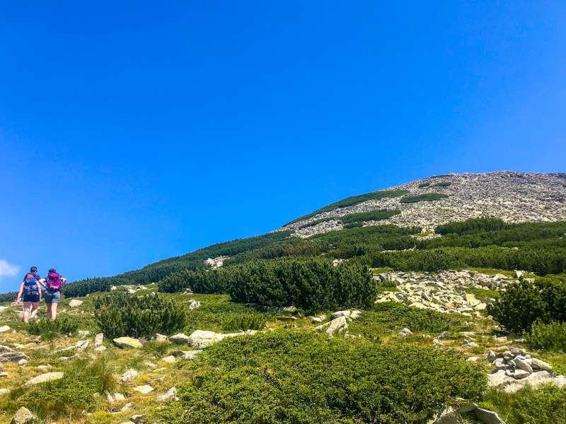 two hiking women near the mountain