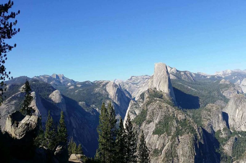 View alarge part of Yosemite from Half Dome. This is a an easy hiking trail that is relatively easy.